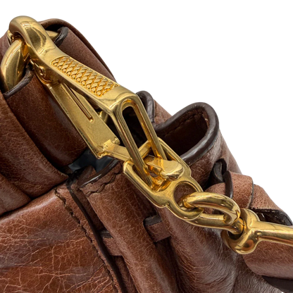 https://cdn.shopify.com/s/files/1/0564/9376/8855/files/Miu_Miu_Handtasche_Vitello_Lux_mit_Umhangegurt_aus_Leder_braun_vintage6505.webp?v=1778682434