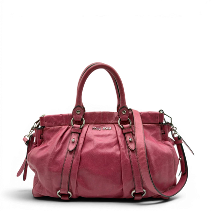 https://cdn.shopify.com/s/files/1/0564/9376/8855/files/Miu_Miu_Handtasche_Vitello_Lux_mit_Umhangegurt_aus_Leder_pink_vintage7946.webp?v=1779965634