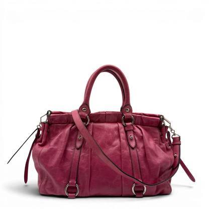https://cdn.shopify.com/s/files/1/0564/9376/8855/files/Miu_Miu_Handtasche_Vitello_Lux_mit_Umhangegurt_aus_Leder_pink_vintage7947.webp?v=1779965634