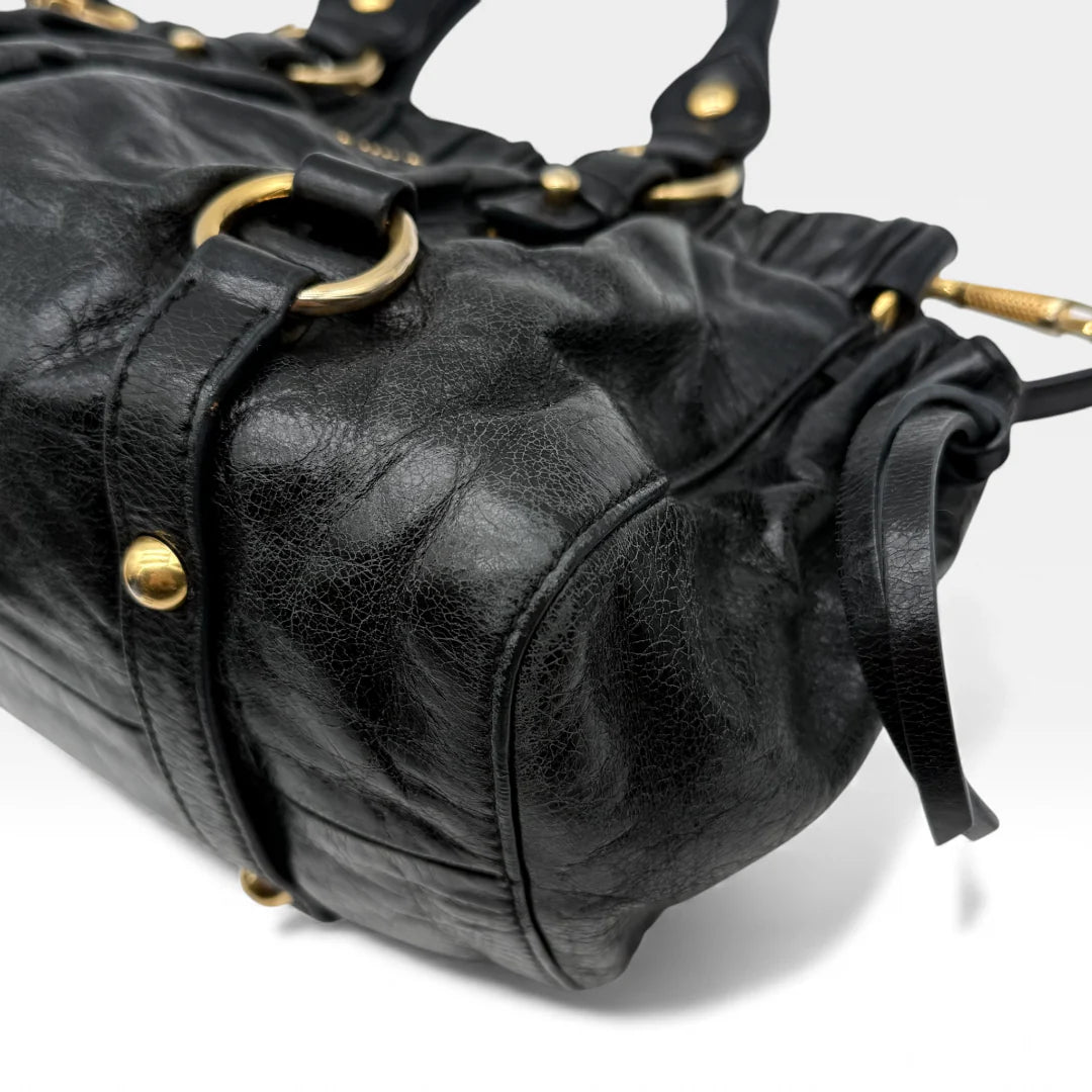 https://cdn.shopify.com/s/files/1/0564/9376/8855/files/Miu_Miu_Handtasche_Vitello_Lux_small_aus_Leder_schwarz_vintage_handbag4876.webp?v=1764952235