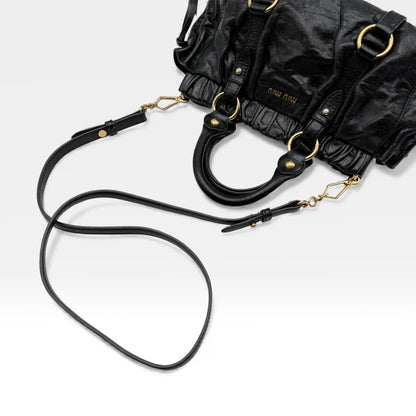https://cdn.shopify.com/s/files/1/0564/9376/8855/files/Miu_Miu_Handtasche_Vitello_Lux_small_aus_Leder_schwarz_vintage_handbag4879.webp?v=1764952235
