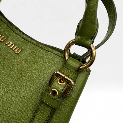 https://cdn.shopify.com/s/files/1/0564/9376/8855/files/Miu_Miu_Handtasche_Vitello_Phenix_aus_Leder_grun_vintage_handbag1376.webp?v=1761872664