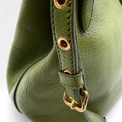 https://cdn.shopify.com/s/files/1/0564/9376/8855/files/Miu_Miu_Handtasche_Vitello_Phenix_aus_Leder_grun_vintage_handbag1378.webp?v=1761872664