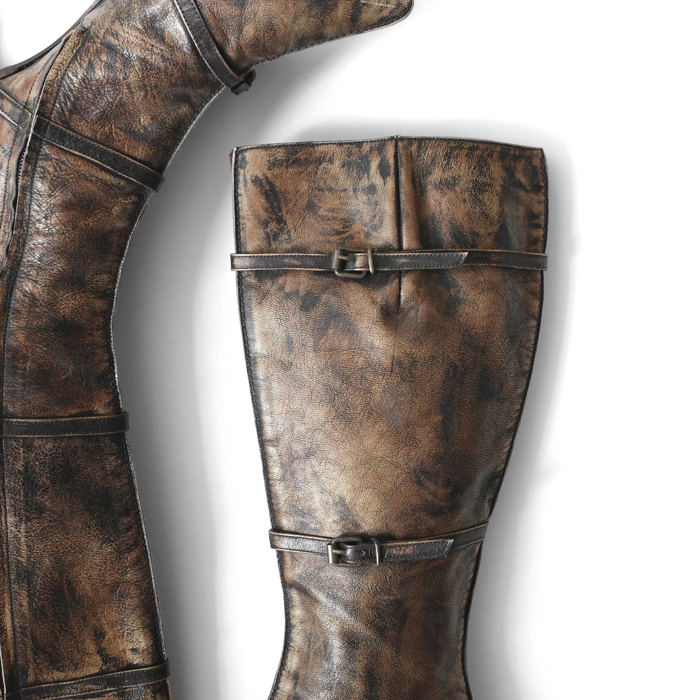 https://images.squarespace-cdn.com/content/v1/673cad159307f210013ba2f7/8d55018c-ca48-4a46-a520-24031d163eaf/Muxart_2000s_DistressedLeatherKneeBoots_3.jpg