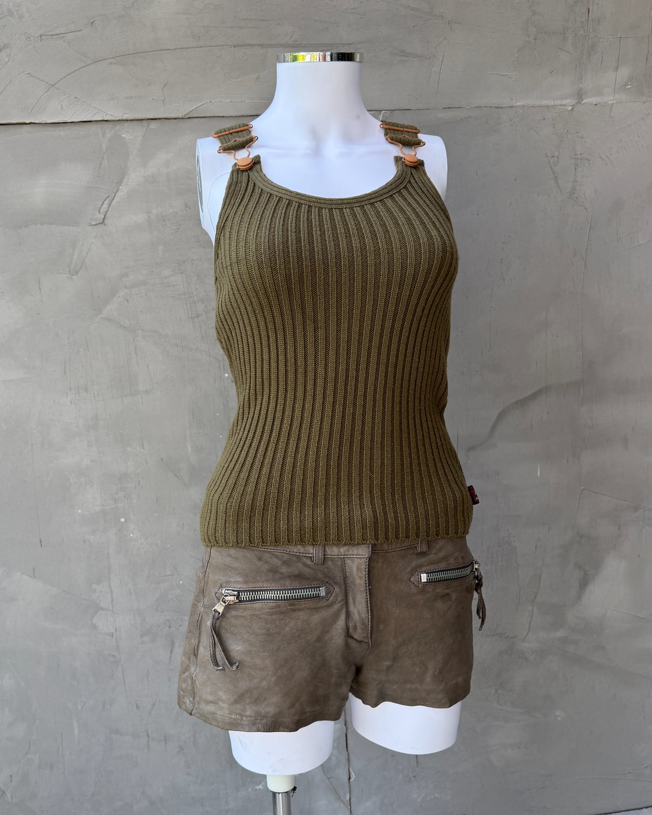 JPG Jeans Ripped Dark Green Tank Top – S-on a concrete background
