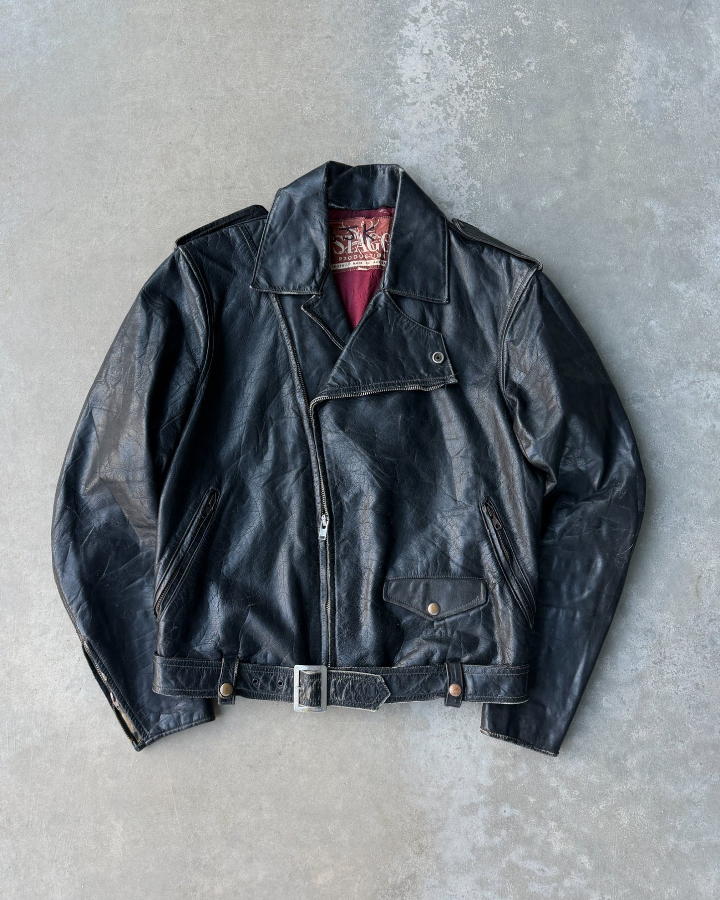 1960s Staggs Leather Moto Jacket – S-on a concrete background