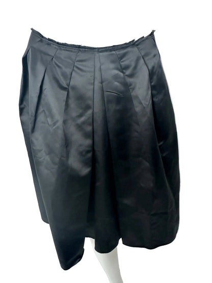Black skirt on a white mannequin against a light gray background