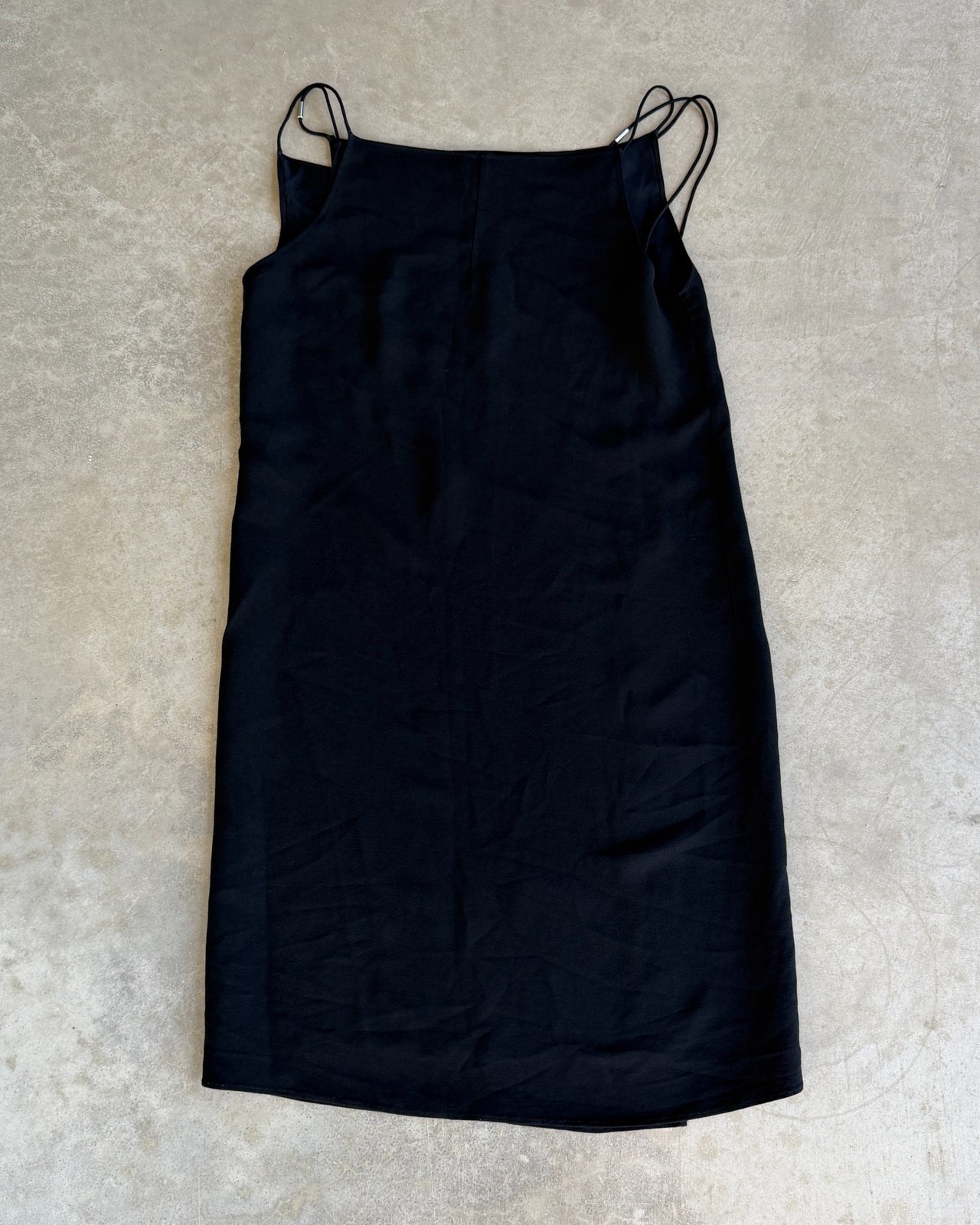 Francisco Costa for Calvin Klein Black Wrap Panel Dress-on a concrete background