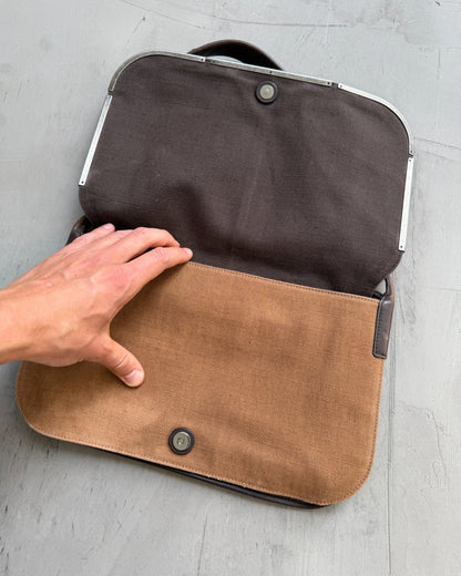 Yves Saint Laurent Brown Canvas Shoulder Bag-on a concrete background