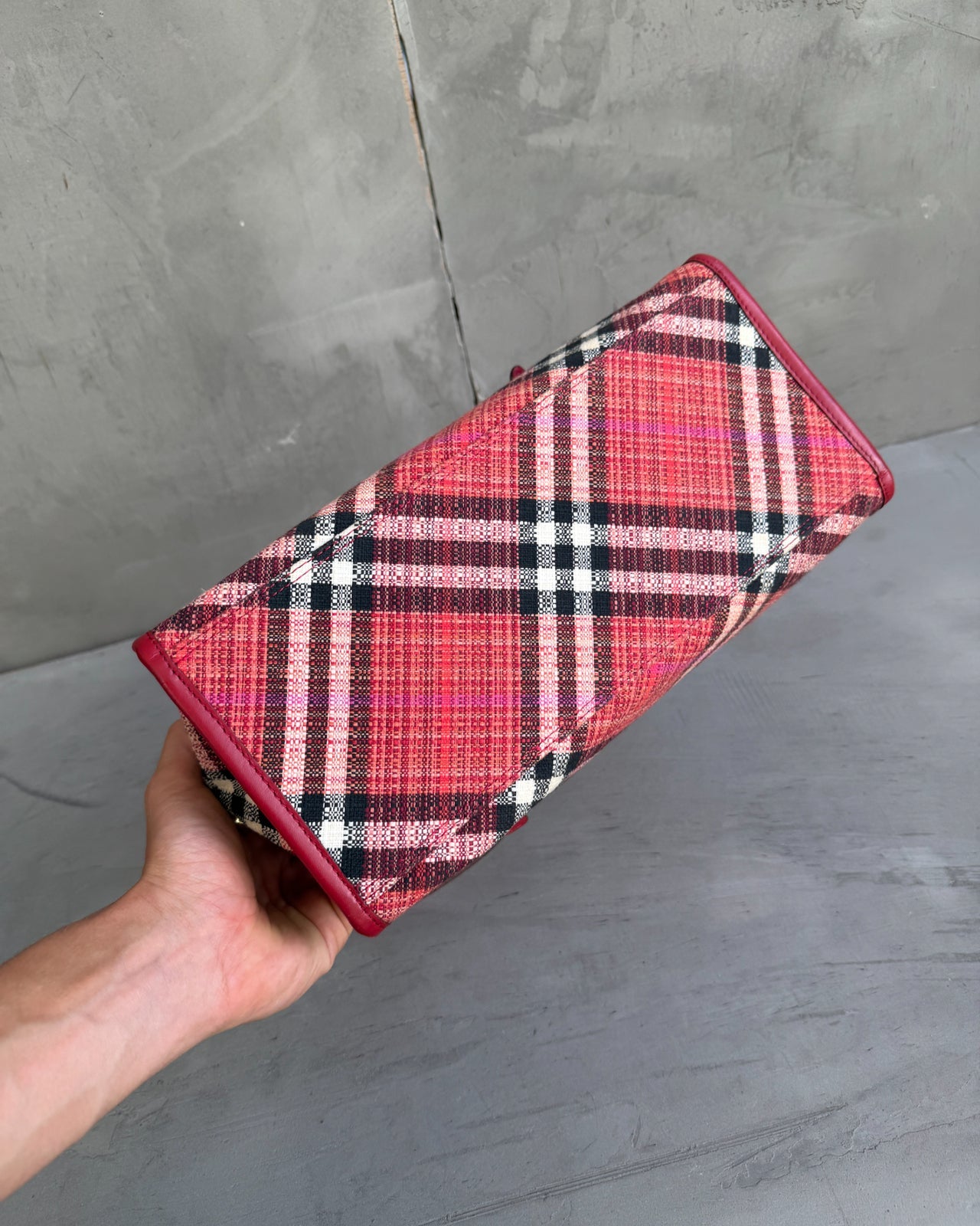Burberry Blue Label Nova Print Red Bag-on a concrete background