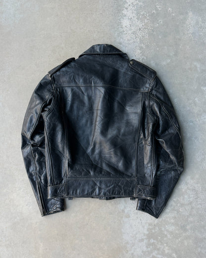 1960s Staggs Leather Moto Jacket – S-on a concrete background