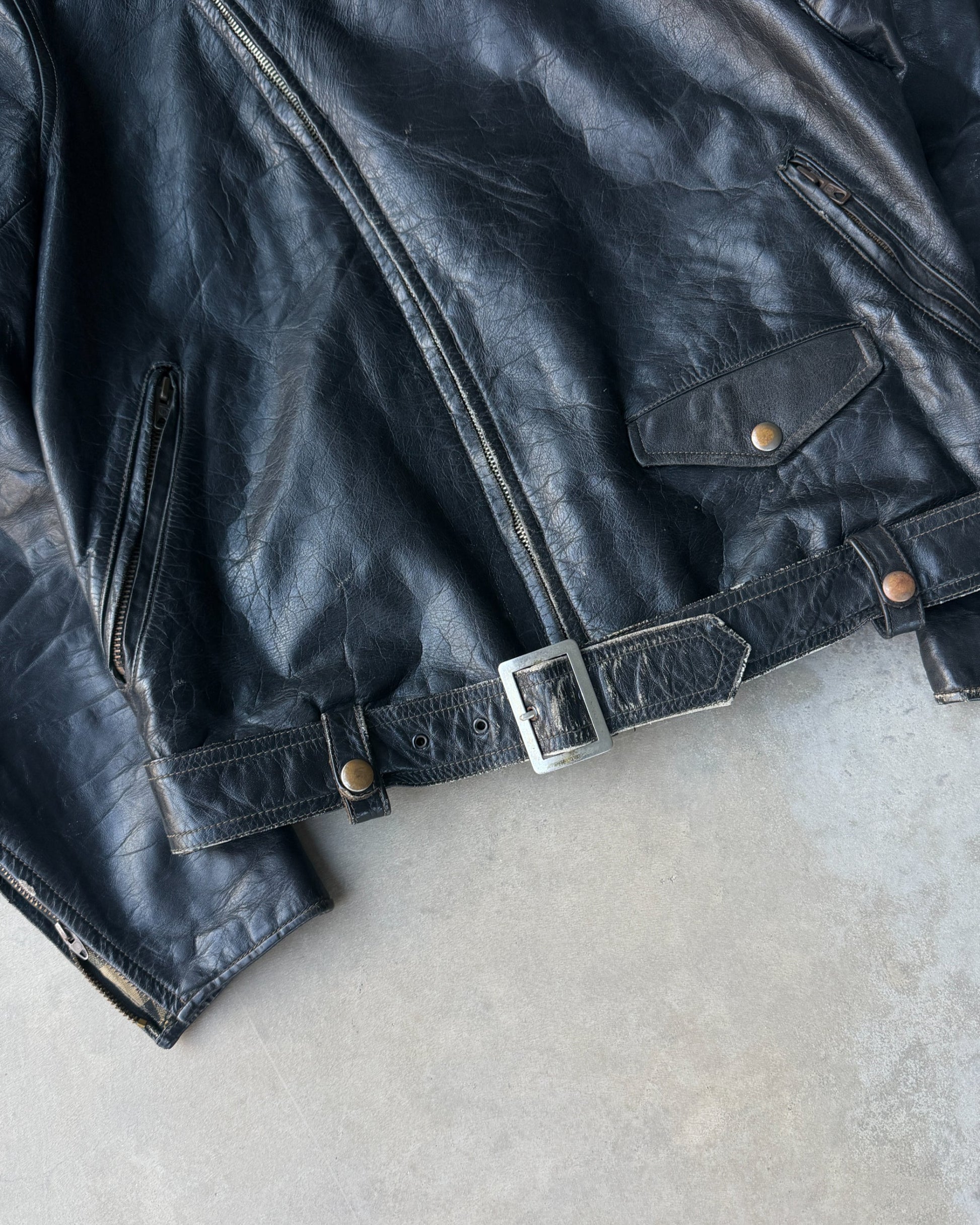 1960s Staggs Leather Moto Jacket – S-on a concrete background