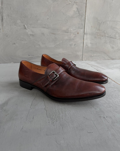 Prada Buckle Leather Derbys – UK 9-on a concrete background