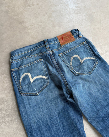 Vintage Evisu Jeans – W30–31-on a concrete background