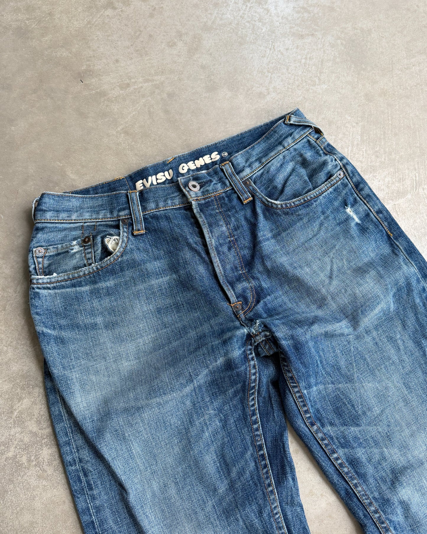 Vintage Evisu Jeans – W30–31-on a concrete background