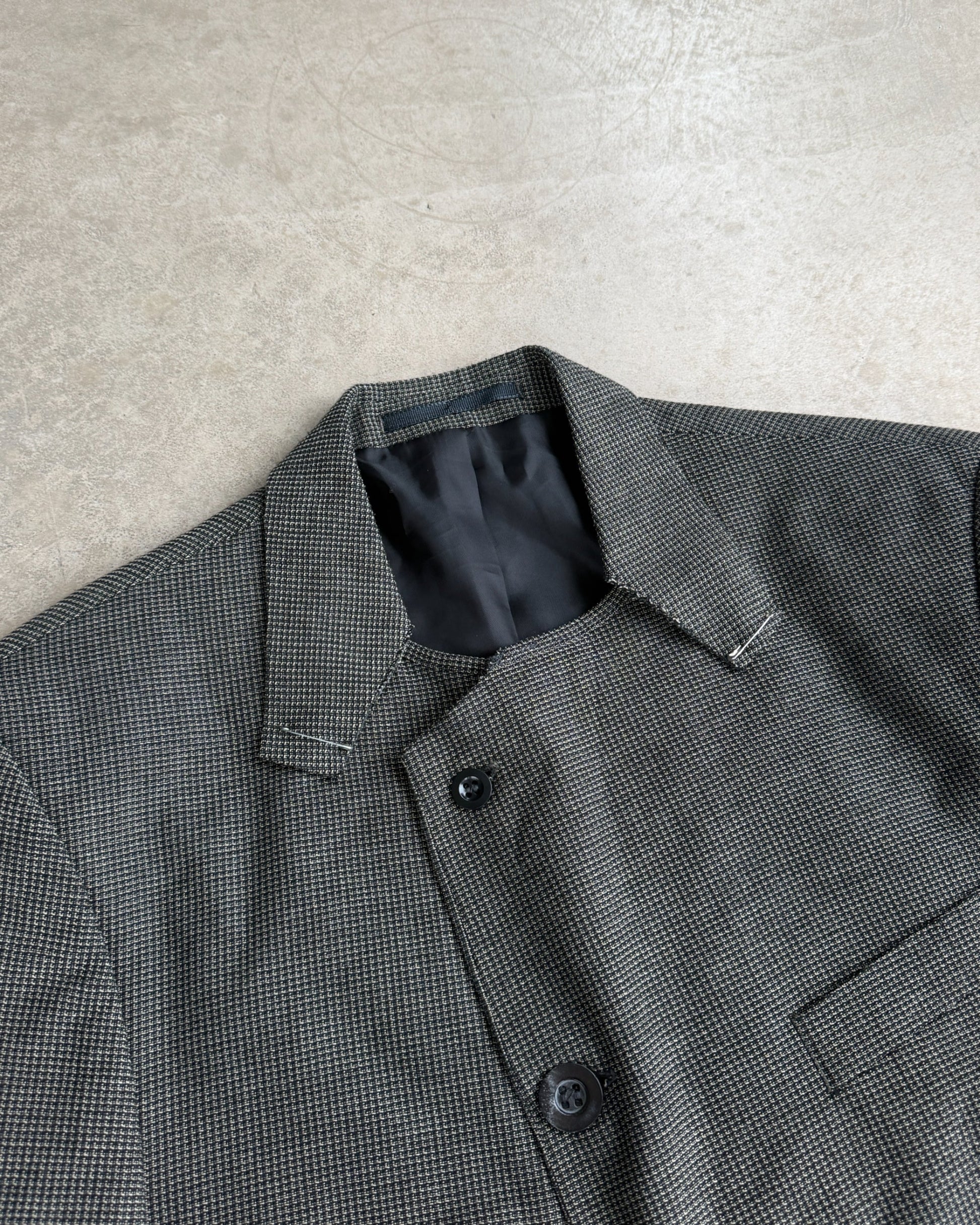 M Classic Altered Wool Jacket with Safety Pins – L-on a concrete background