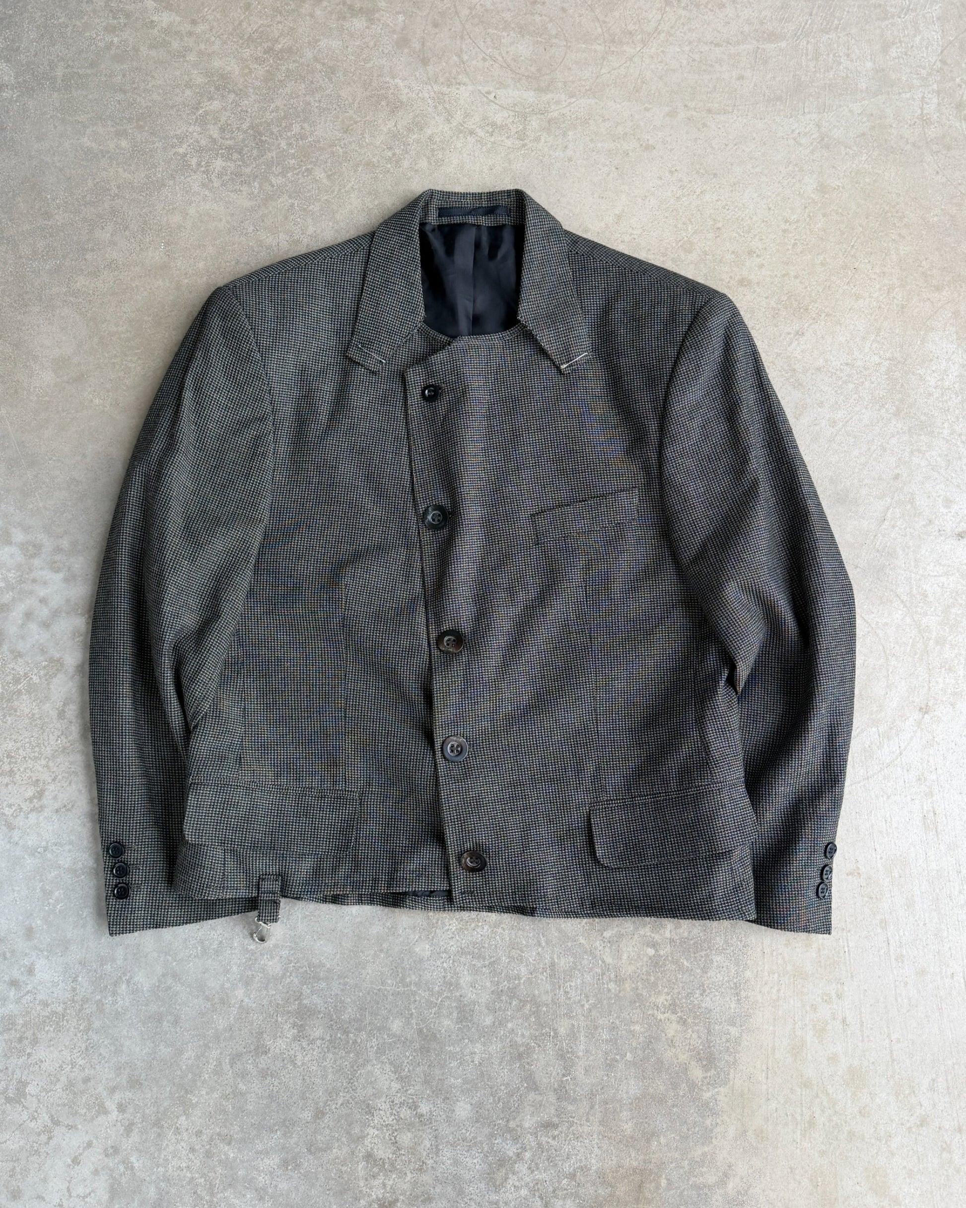 M Classic Altered Wool Jacket with Safety Pins – L-on a concrete background