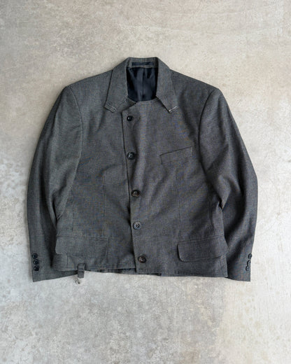 M Classic Altered Wool Jacket with Safety Pins – L-on a concrete background