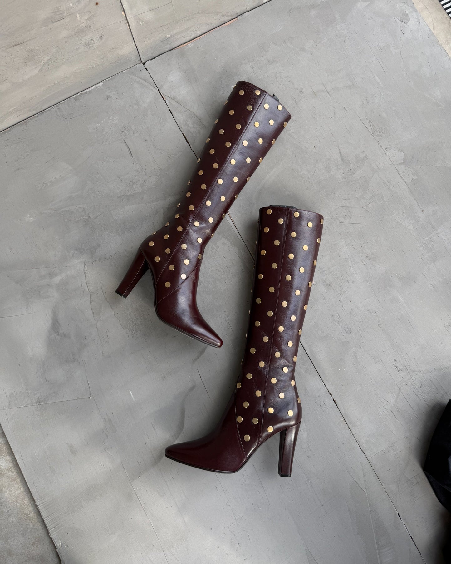 Saint Laurent Studded Leather Heeled Boots – EU 40-on a concrete background