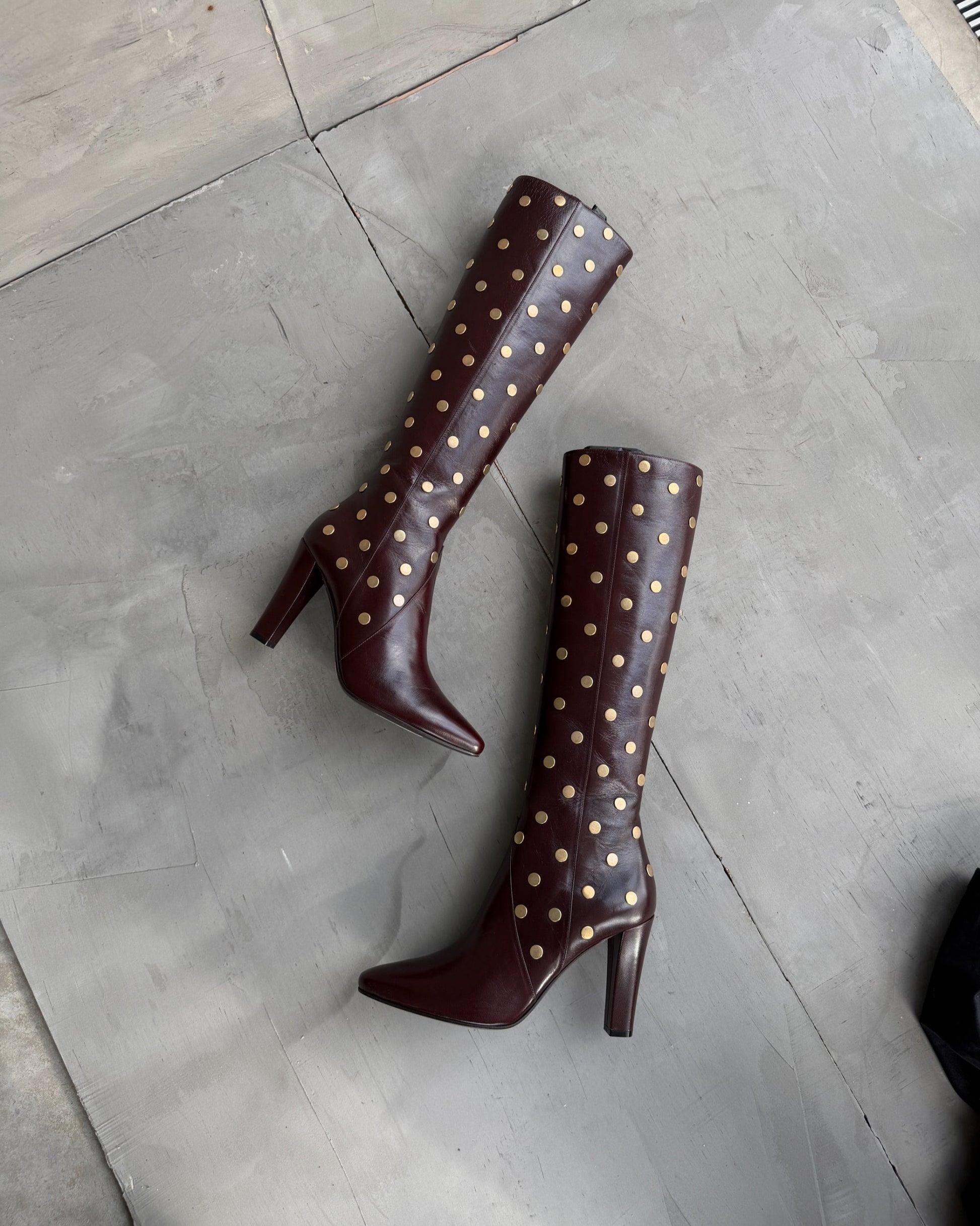 Saint Laurent Studded Leather Heeled Boots – EU 40-on a concrete background