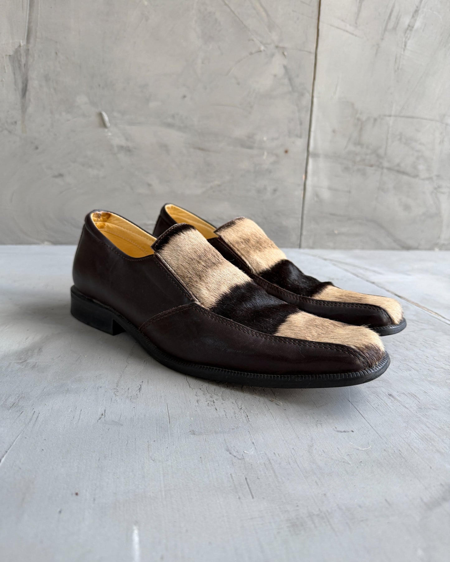 Manock Zebra Skin Loafers – EU 43-on a concrete background