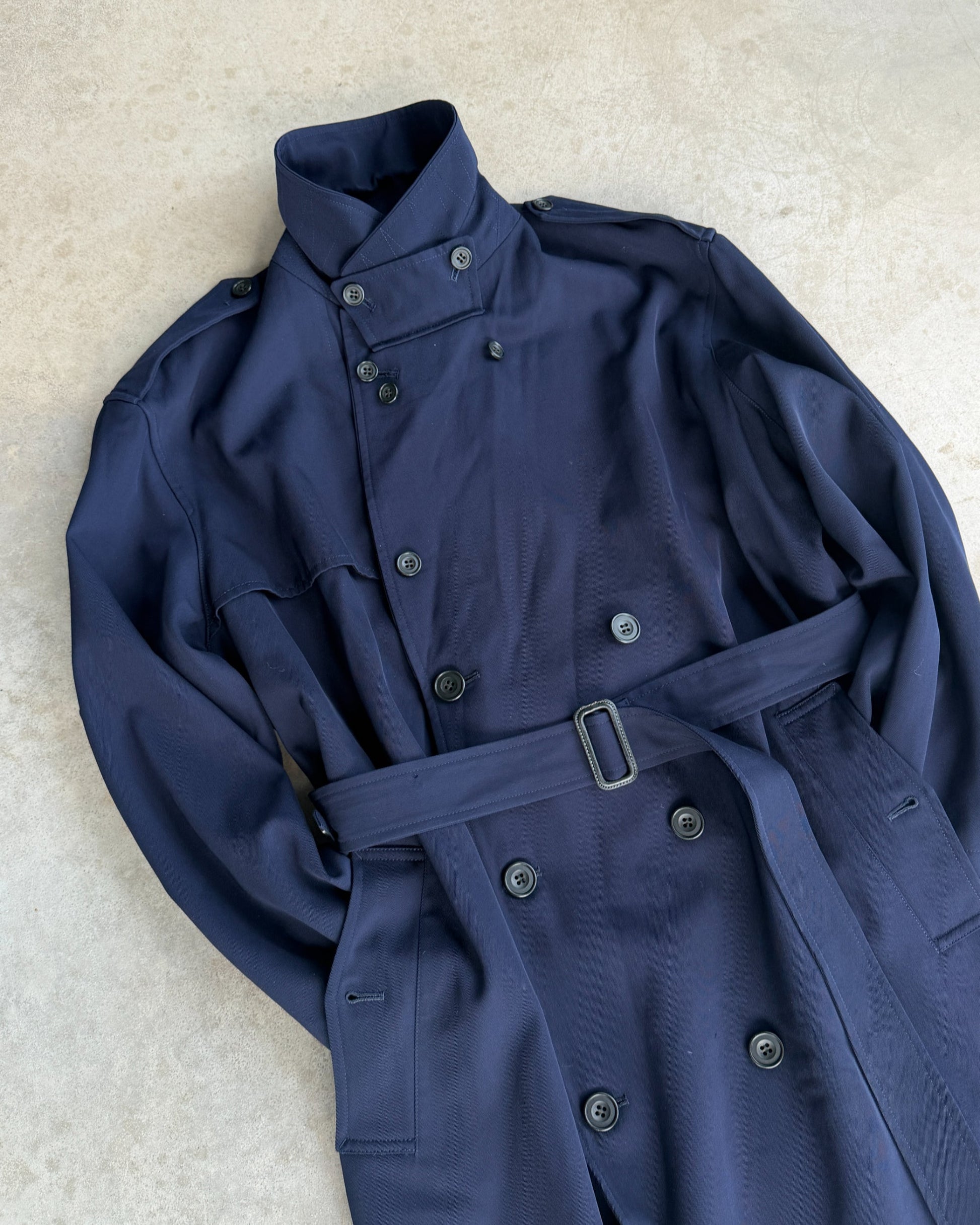 Yohji Yamamoto AW04 Trench Mac Coat – L-on a concrete background
