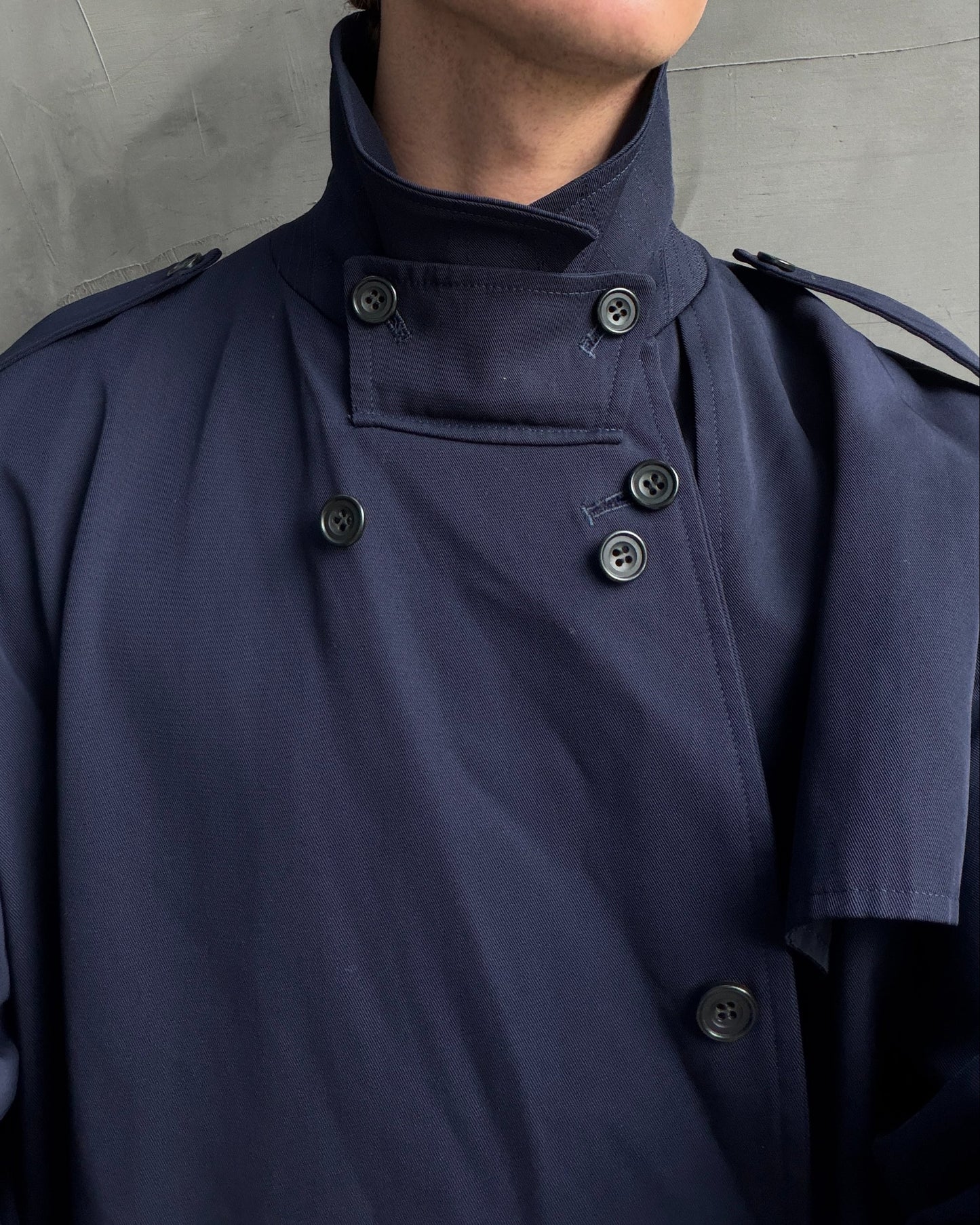 Yohji Yamamoto AW04 Trench Mac Coat – L-on a concrete background