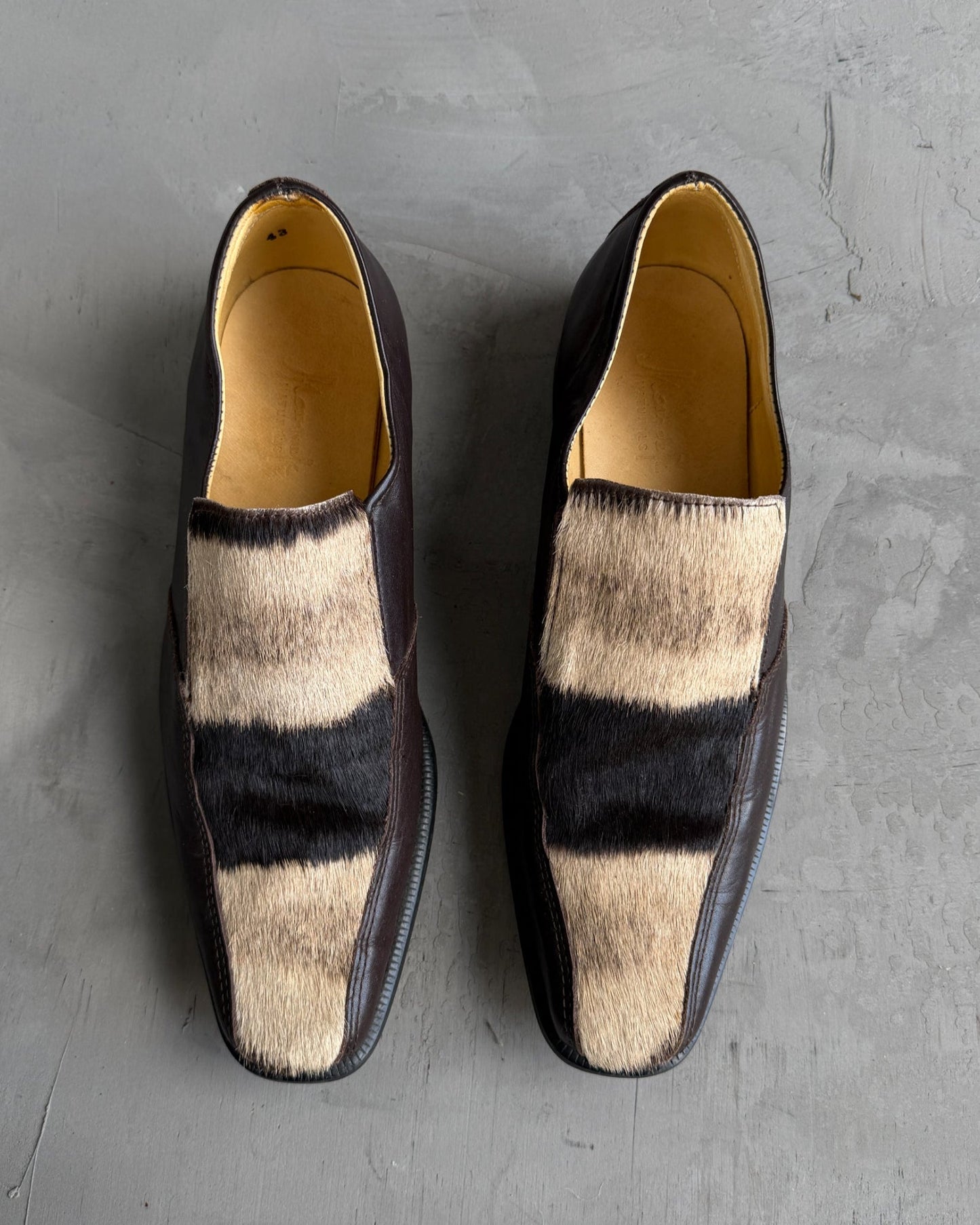 Manock Zebra Skin Loafers – EU 43-on a concrete background