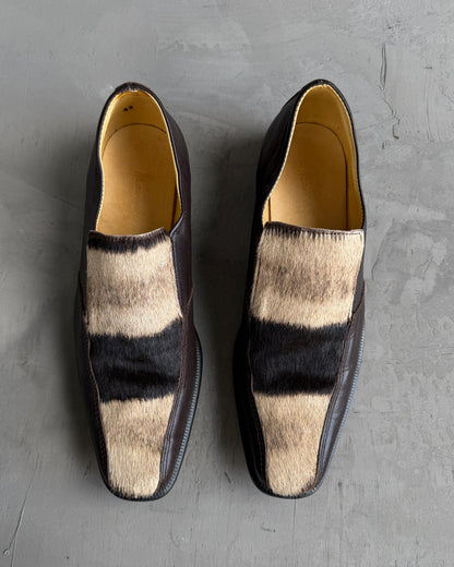 Manock Zebra Skin Loafers – EU 43-on a concrete background
