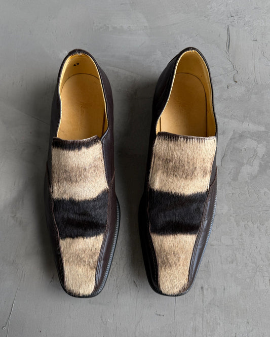 Manock Zebra Skin Loafers – EU 43-on a concrete background