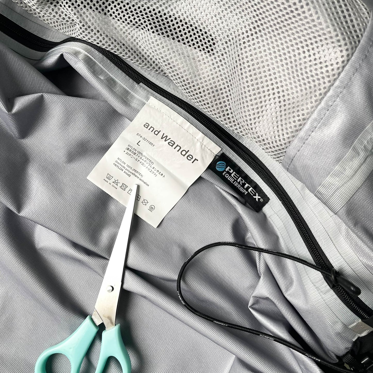 And Wander Pertex Shield Rain Jacket (L)