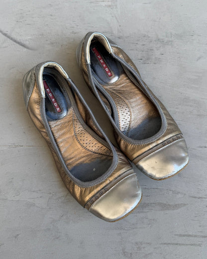 Prada White Gold and Silver Ballet Flat – EU 37-on a concrete background