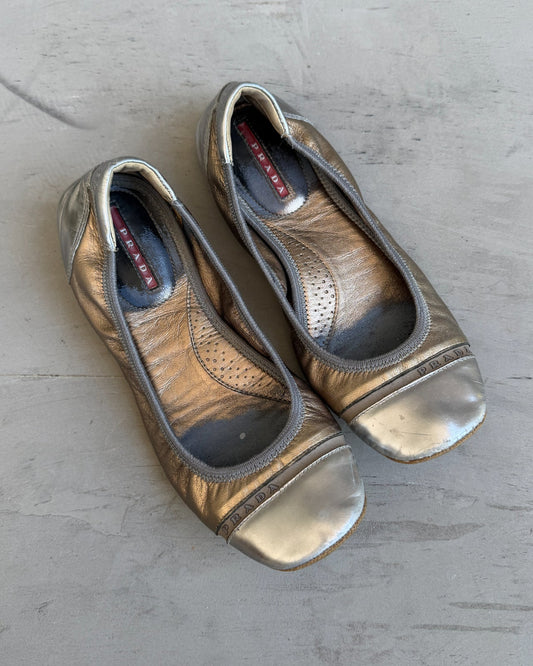 Prada White Gold and Silver Ballet Flat – EU 37-on a concrete background