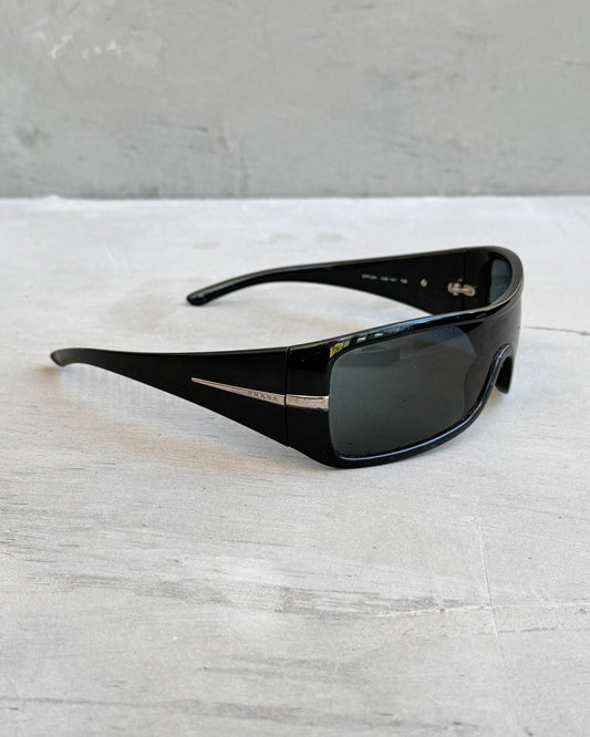 Prada Black Wraparound Sunglasses-on a concrete background