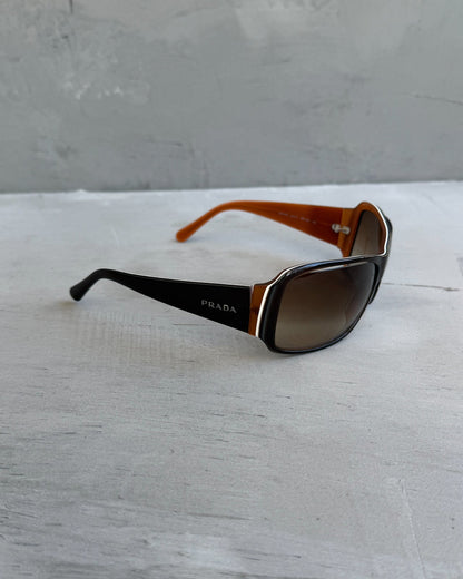 Prada Brown Sunglasses-on a concrete background