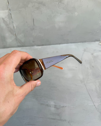 Prada Brown Sunglasses-on a concrete background