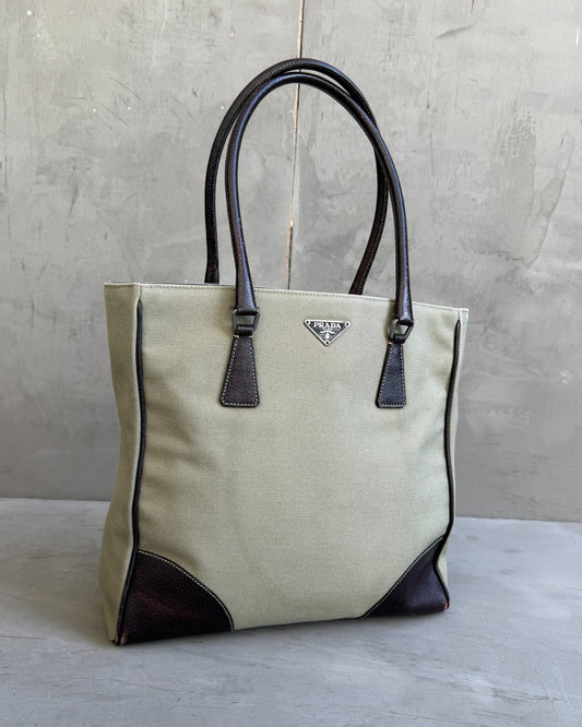 Prada Canvas and Leather Tote Bag-on a concrete background