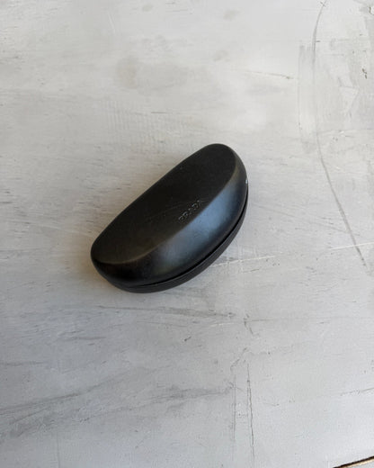 Prada Brown Sunglasses-on a concrete background