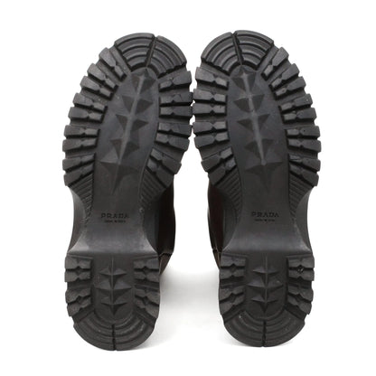 https://images.squarespace-cdn.com/content/v1/673cad159307f210013ba2f7/fc62637d-14fc-4fba-971c-3b78b1147689/Prada_2000s_BrownLeatherLugSoleBoots39_7.jpg