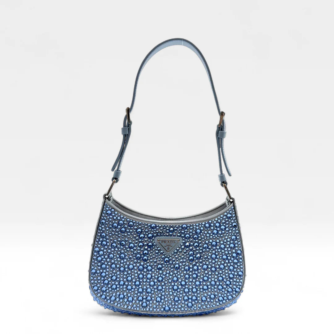 https://cdn.shopify.com/s/files/1/0564/9376/8855/files/Prada_Handtasche_Cleo_Kristall_aus_Nylon_hellblau_handbag5067_4c3e1774-d851-40ab-97cc-0373877f58aa.webp?v=1761263519
