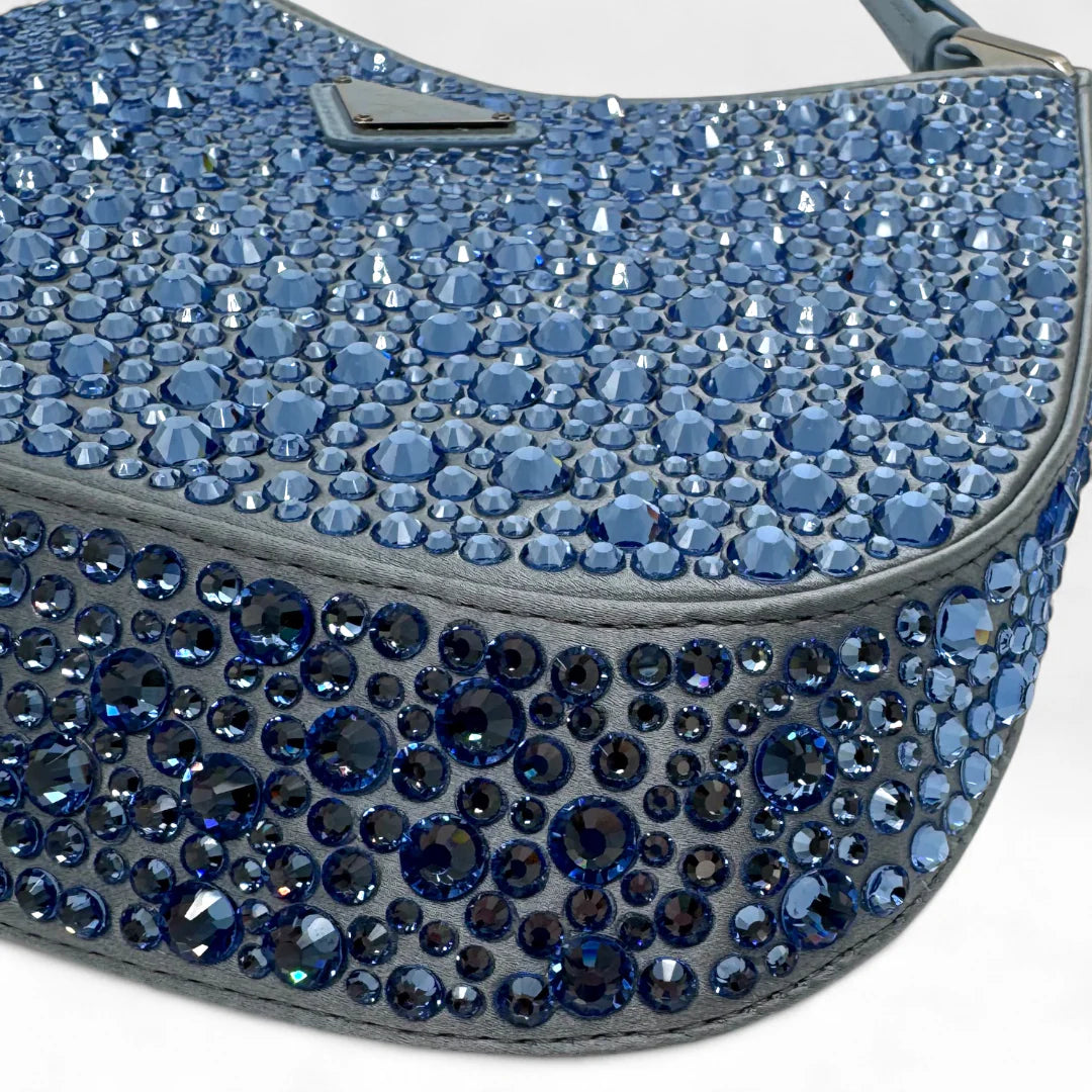 https://cdn.shopify.com/s/files/1/0564/9376/8855/files/Prada_Handtasche_Cleo_Kristall_aus_Nylon_hellblau_handbag5073_4ac717d9-7ba2-4eea-b8b1-d051cb2fff77.webp?v=1761263459