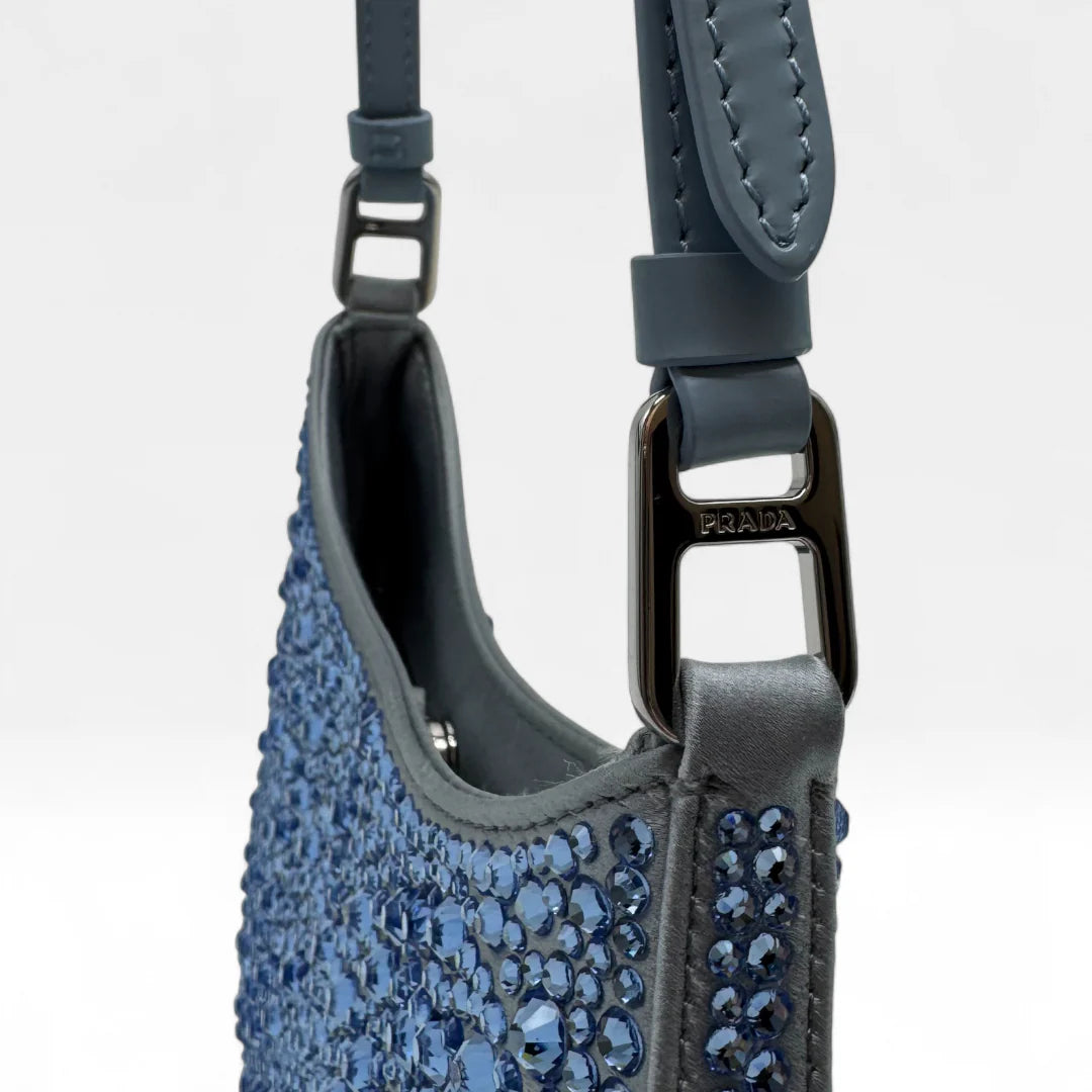 https://cdn.shopify.com/s/files/1/0564/9376/8855/files/Prada_Handtasche_Cleo_Kristall_aus_Nylon_hellblau_handbag5079_d9741c4d-c8f3-4198-a507-0e9bab9ed20f.webp?v=1761263458
