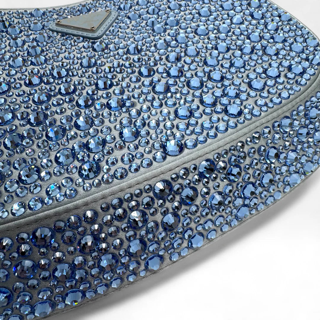 https://cdn.shopify.com/s/files/1/0564/9376/8855/files/Prada_Handtasche_Cleo_Kristall_aus_Nylon_hellblau_handbag5081_d4b0f429-73fd-47ed-ad07-17dd23890145.webp?v=1761263458