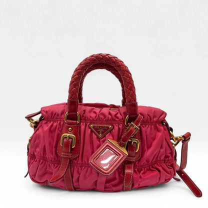 https://cdn.shopify.com/s/files/1/0564/9376/8855/files/Prada_Handtasche_Pocono_aus_Nylon_pink_second_hand_designer_handbag3382.webp?v=1757505526