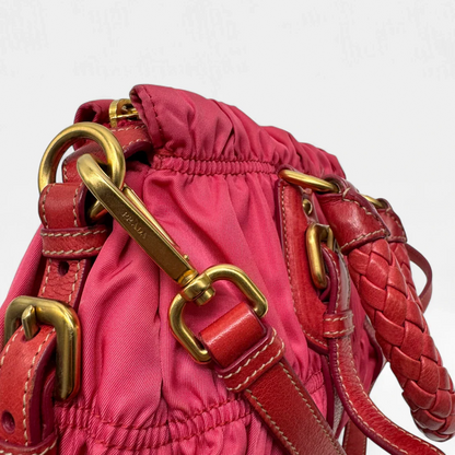 https://cdn.shopify.com/s/files/1/0564/9376/8855/files/Prada_Handtasche_Pocono_aus_Nylon_pink_second_hand_designer_handbag3395.webp?v=1757505483
