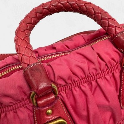 https://cdn.shopify.com/s/files/1/0564/9376/8855/files/Prada_Handtasche_Pocono_aus_Nylon_pink_second_hand_designer_handbag3397.webp?v=1757505484