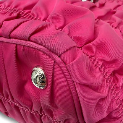 https://cdn.shopify.com/s/files/1/0564/9376/8855/files/Prada_Handtasche_Pocono_aus_Nylon_pink_vintage_handbag8834.webp?v=1760007617