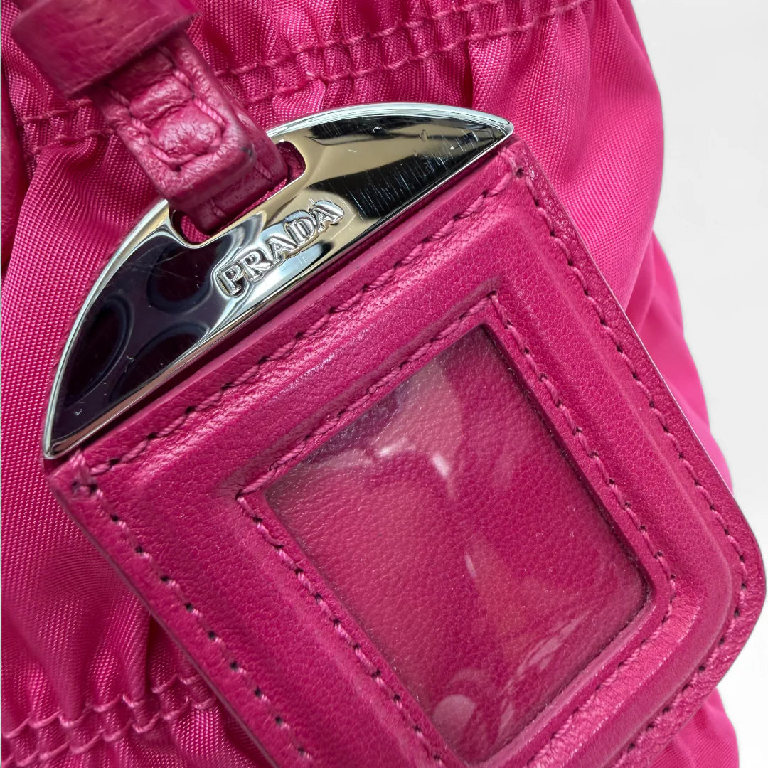 https://cdn.shopify.com/s/files/1/0564/9376/8855/files/Prada_Handtasche_Pocono_aus_Nylon_pink_vintage_handbag8839.webp?v=1760007617