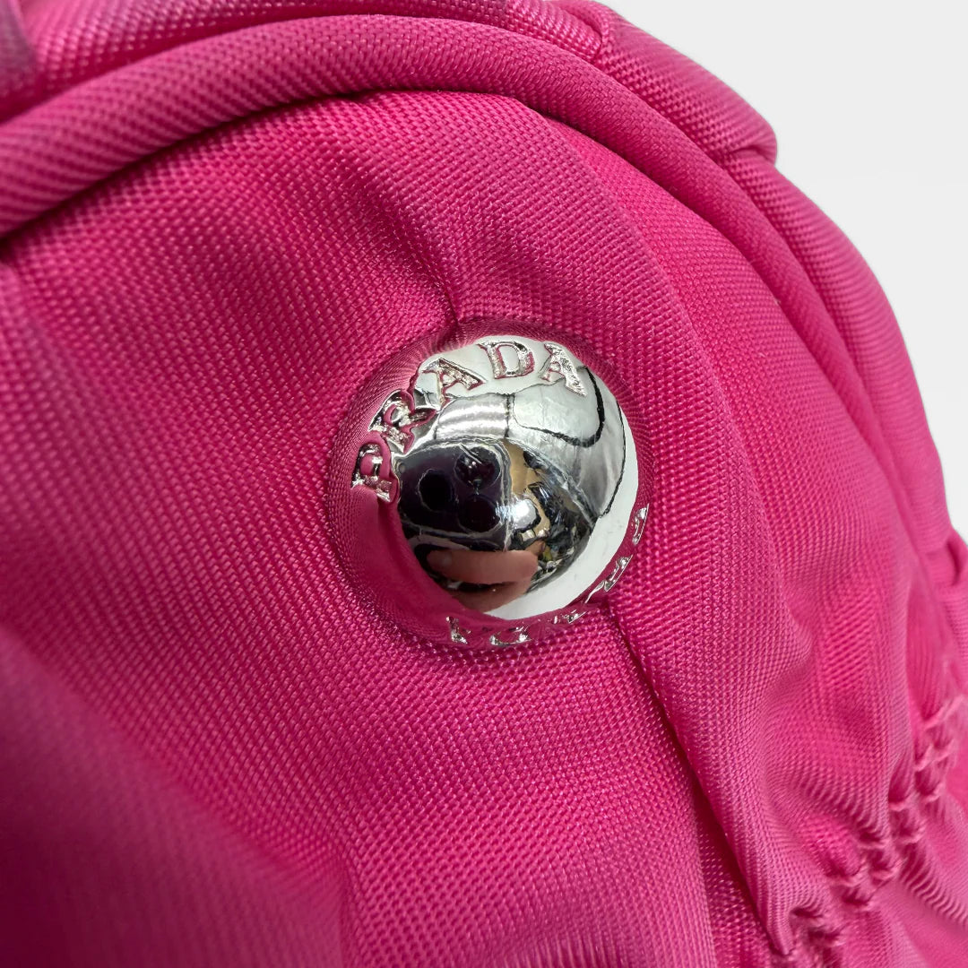 https://cdn.shopify.com/s/files/1/0564/9376/8855/files/Prada_Handtasche_Pocono_aus_Nylon_pink_vintage_handbag8841.webp?v=1760007617