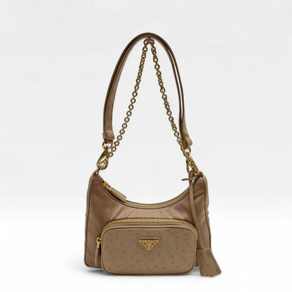 https://cdn.shopify.com/s/files/1/0564/9376/8855/files/Prada_Handtasche_Re-Nylon_Strauss_beige_handbag5043.webp?v=1761264119